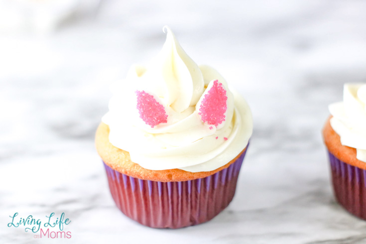 Frosting and marshmallow ears on the unicorn cupcakes