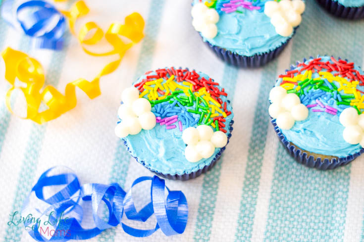 These Rainbow Sprinkles Cupcakes are too cute and easy to make! Perfect for birthday parties or just as a fun dessert, everyone will love these decorated cupcakes! #dessert #cupcakes #decoratingcupcakes #rainbows 