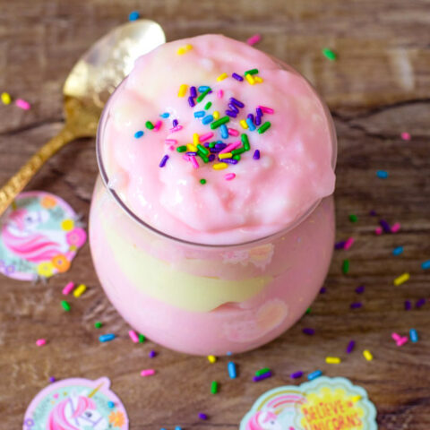 This magic unicorn pudding recipe is so fun to create! The bright colors and sprinkles are a beautiful sight to see! And the flavor is awesome! If you're looking for a simple Unicorn Dessert, this homemade pudding recipe is one that you don't want to miss! #unicorn #pudding #dessert #magicrecipe