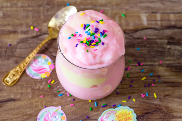 This magic unicorn pudding recipe is so fun to create! The bright colors and sprinkles are a beautiful sight to see! And the flavor is awesome! If you're looking for a simple Unicorn Dessert, this homemade pudding recipe is one that you don't want to miss! #unicorn #pudding #dessert #magicrecipe