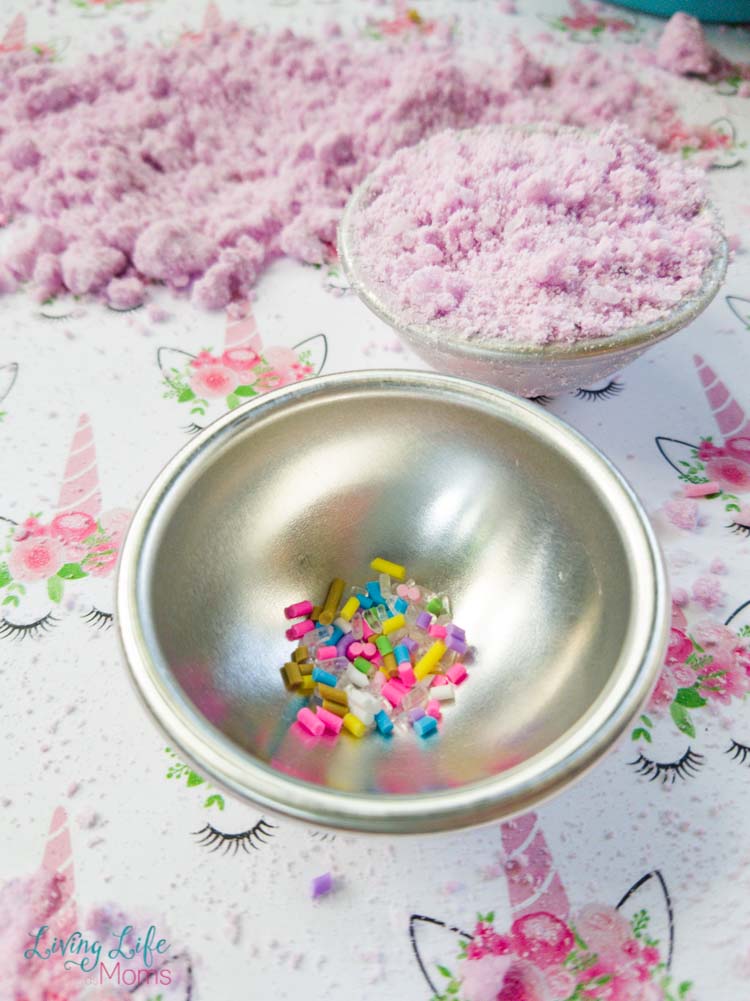 Add sprinkles for unicorn bath bomb in mold