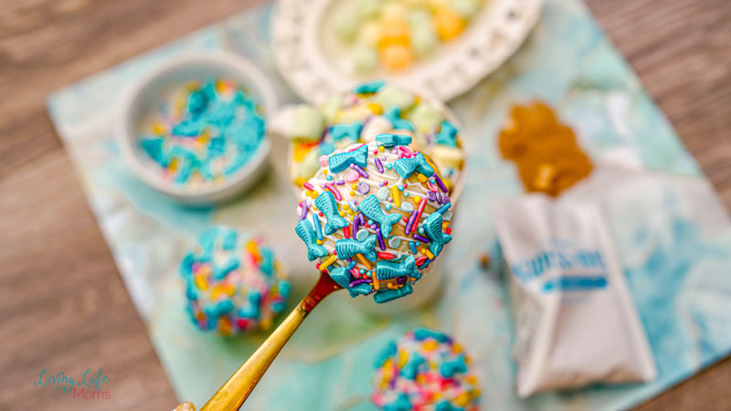 mermaid hot chocolate bomb on a spoon