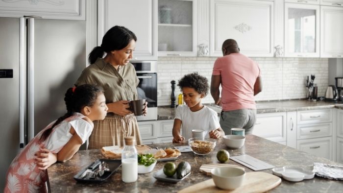 family having breakfast in the kitchen