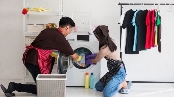 mom and dad doing laundry together