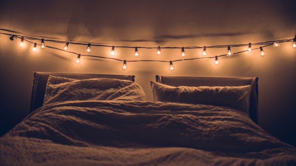 bed with string lights hanging, ideal gift for teen girls, teenager gift ideas