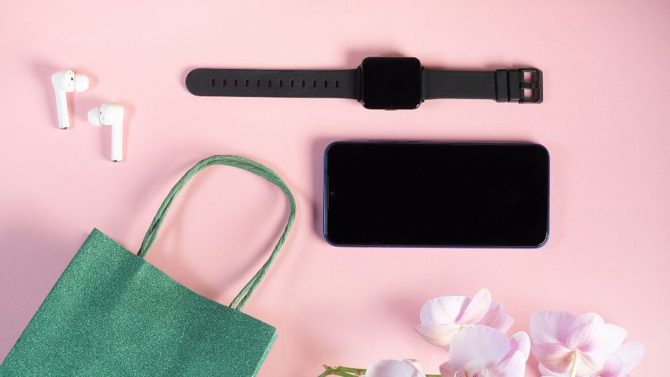 Flatlay with iphone watch and giftbag, ideal gifts for girls, teenager gift ideas