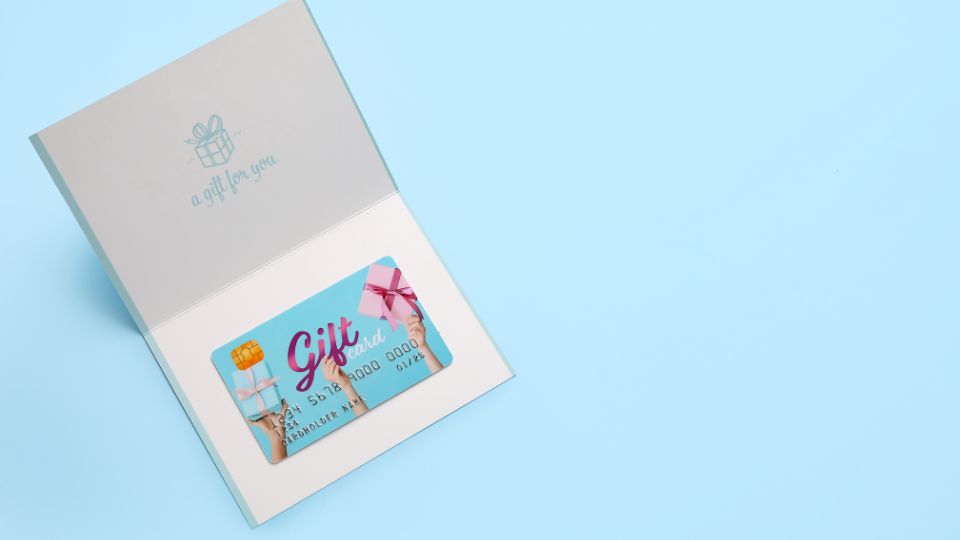 gift card on blue background, ideas for gifting, what to give a girl for her birthday, teenage birthday gift ideas